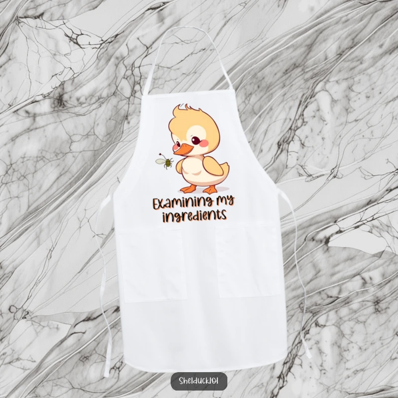 Funny shelduck apron showing a bird curiously eyeing a bug, perfect for kitchen fun and culinary adventures.