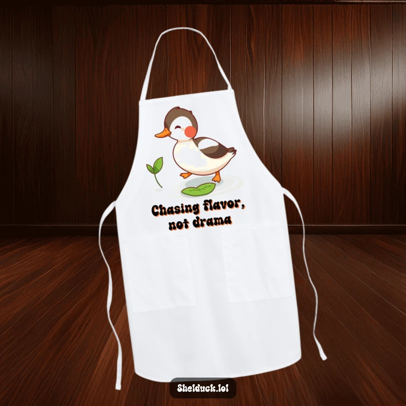 Funny shelduck apron featuring a bird humorously chasing a small leaf, ideal for kitchen antics and food prep.