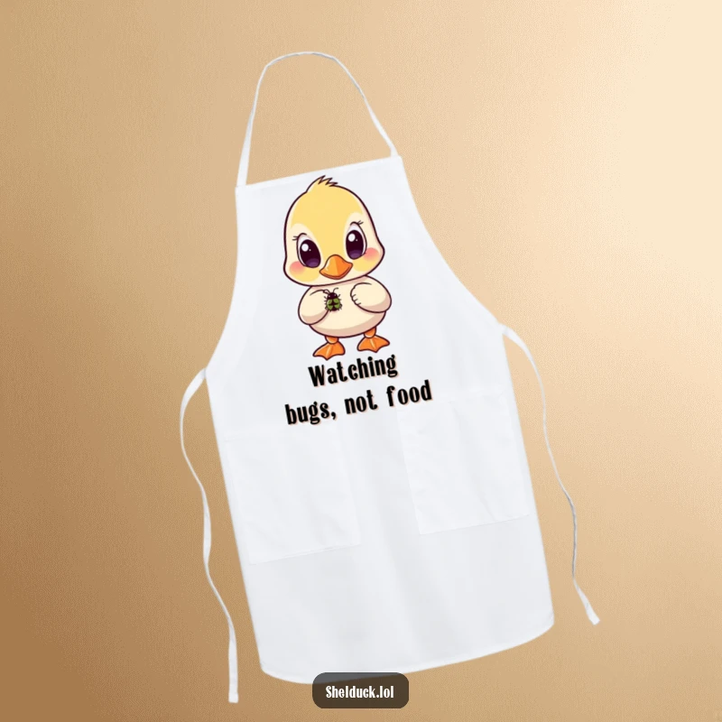Funny shelduck apron showing a bird with wide, curious eyes focused intently on a small bug.