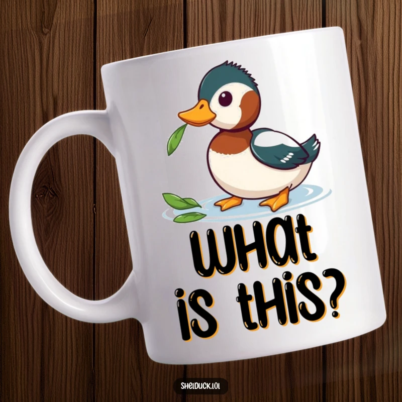 Funny Curious Shelduck Mug showing a shelduck tilting its head inquisitively towards a floating leaf, capturing a moment of wonder.
