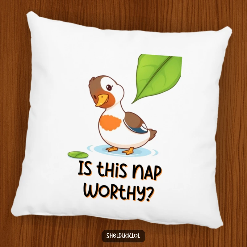 Funny Shelduck Pillow: A soft pillow displaying a shelduck's curious head tilt towards a leaf, offering funny comfort and decor.
