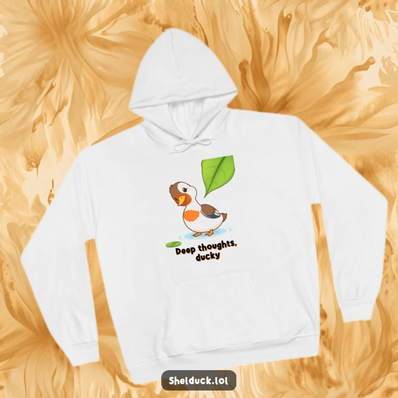 Funny Shelduck Hoodie: A cozy hoodie showcasing a shelduck tilting its head curiously at a leaf, perfect for a funny, warm embrace.