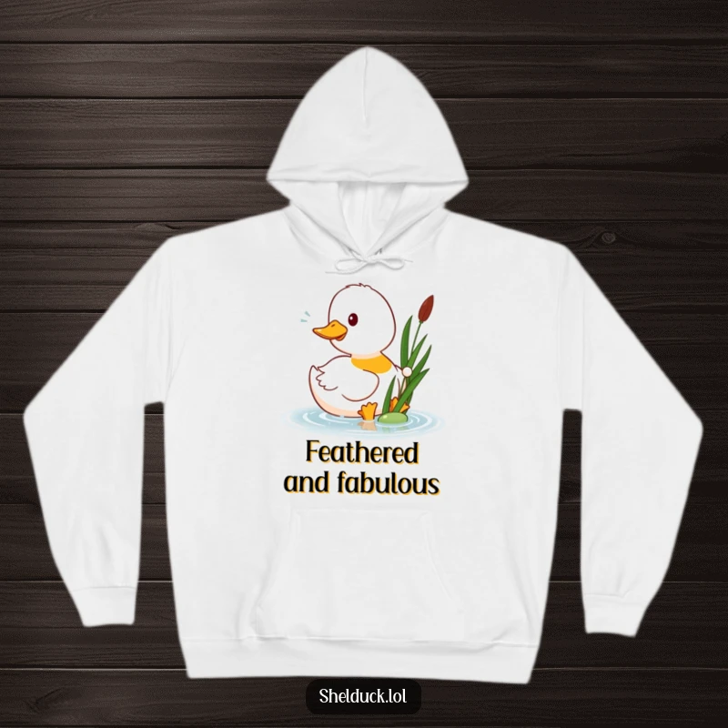 Funny shelduck hoodie showcasing a happy shelduck bird playfully pecking at a floating reed, designed for warmth and amusement.