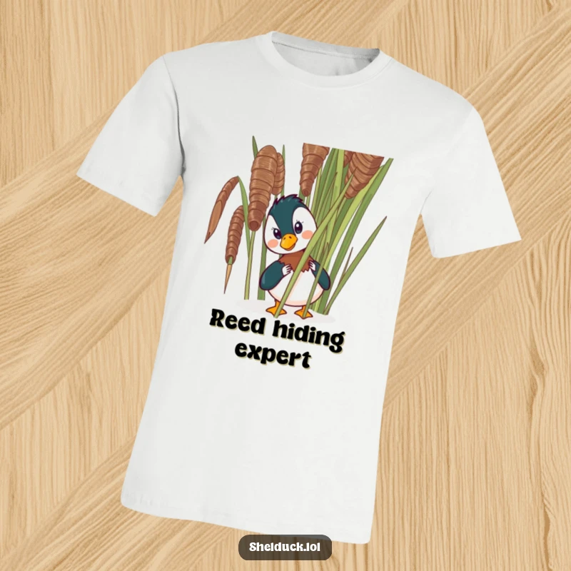Funny shelduck t-shirt depicting a comical bird peeking from behind a large reed, highlighting its sneaky and amusing pose.