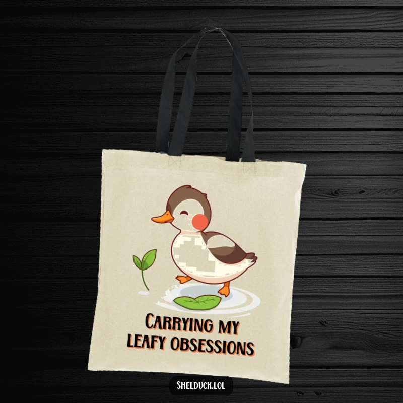 Funny shelduck tote bag featuring a bird gleefully chasing a tiny leaf, showcasing a whimsical and amusing design.