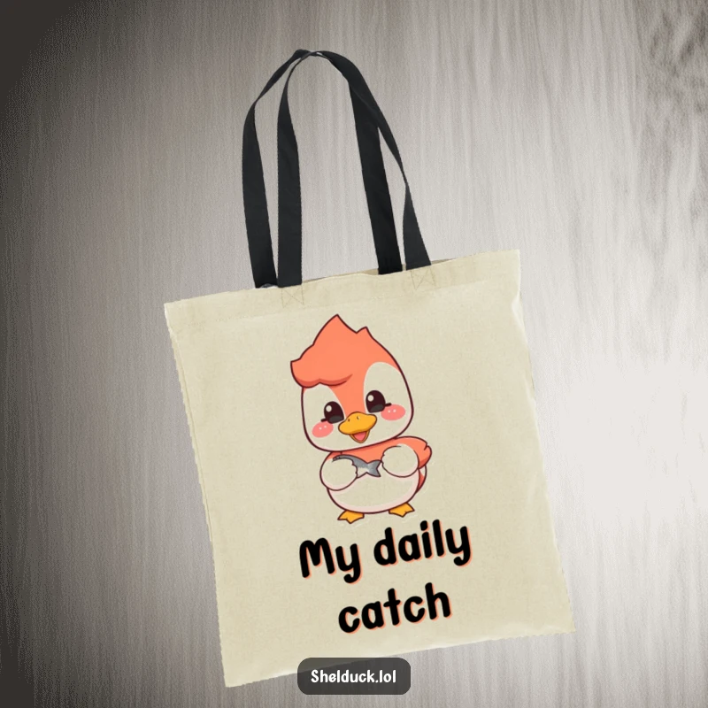 Funny shelduck tote bag featuring a cheerful bird with a fish, great for anglers and everyday use.